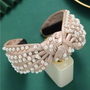 Beige headband with white pearls